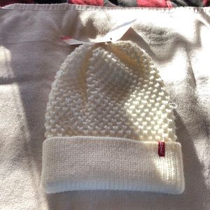 Beanie new but has a couple of loose threads.